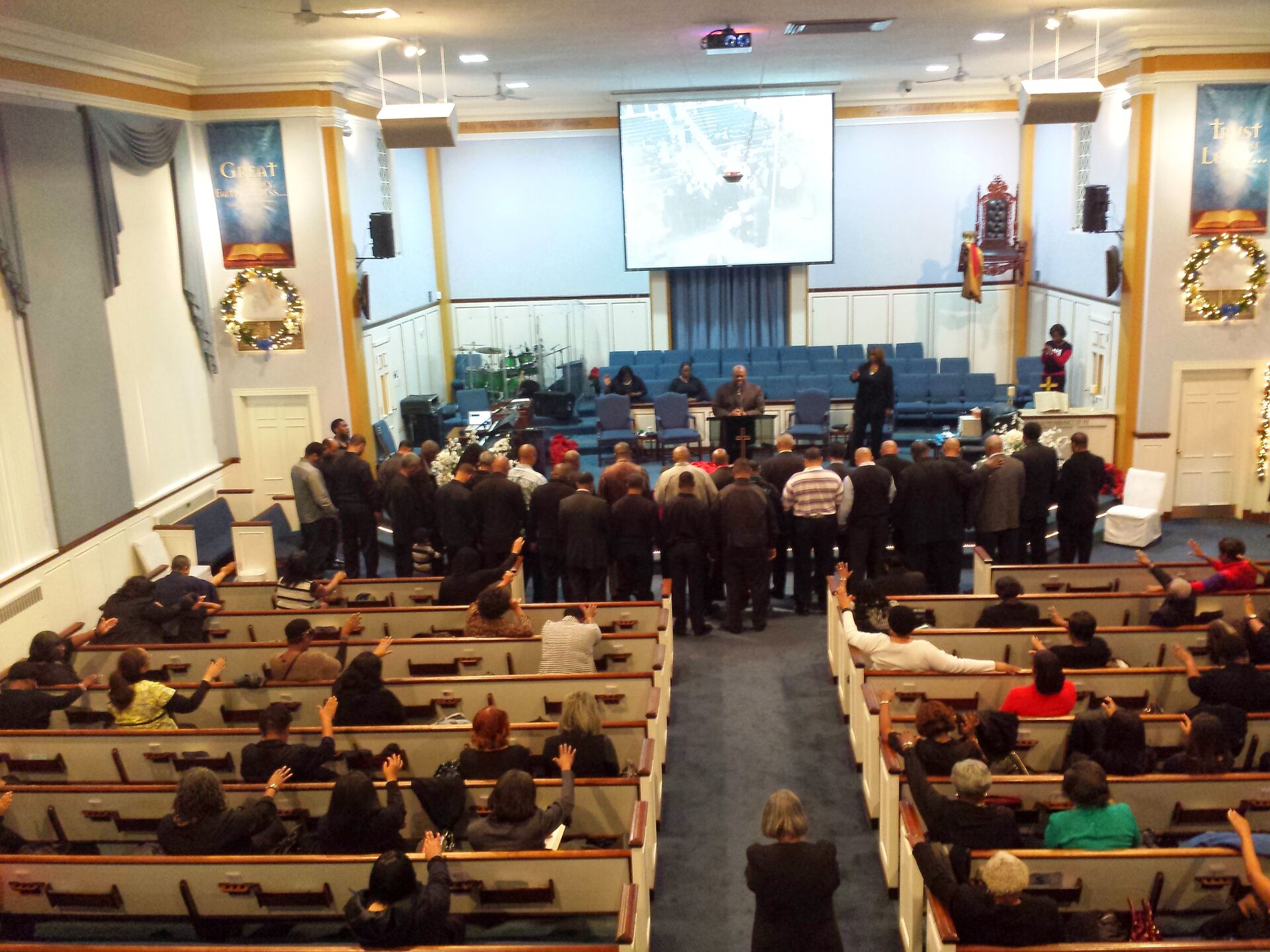 Church interior with congregation worshipping