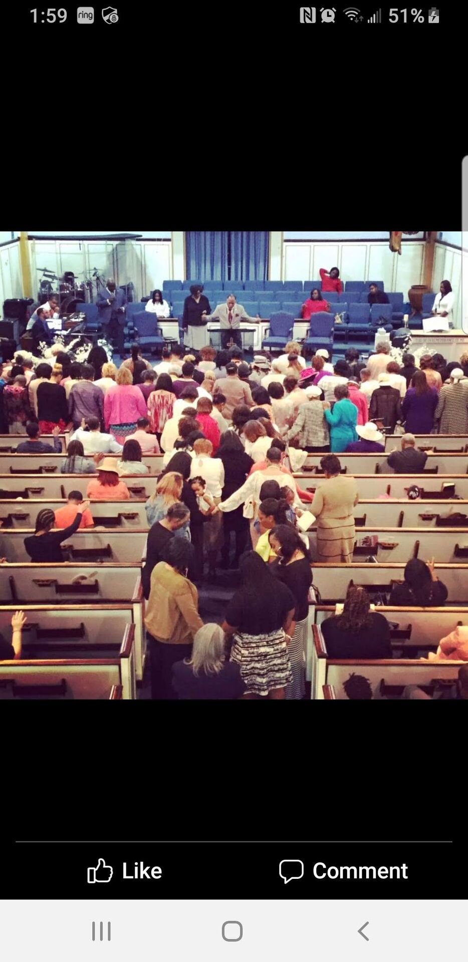 Congregation gathered for worship in the sanctuary at El Bethel Church
